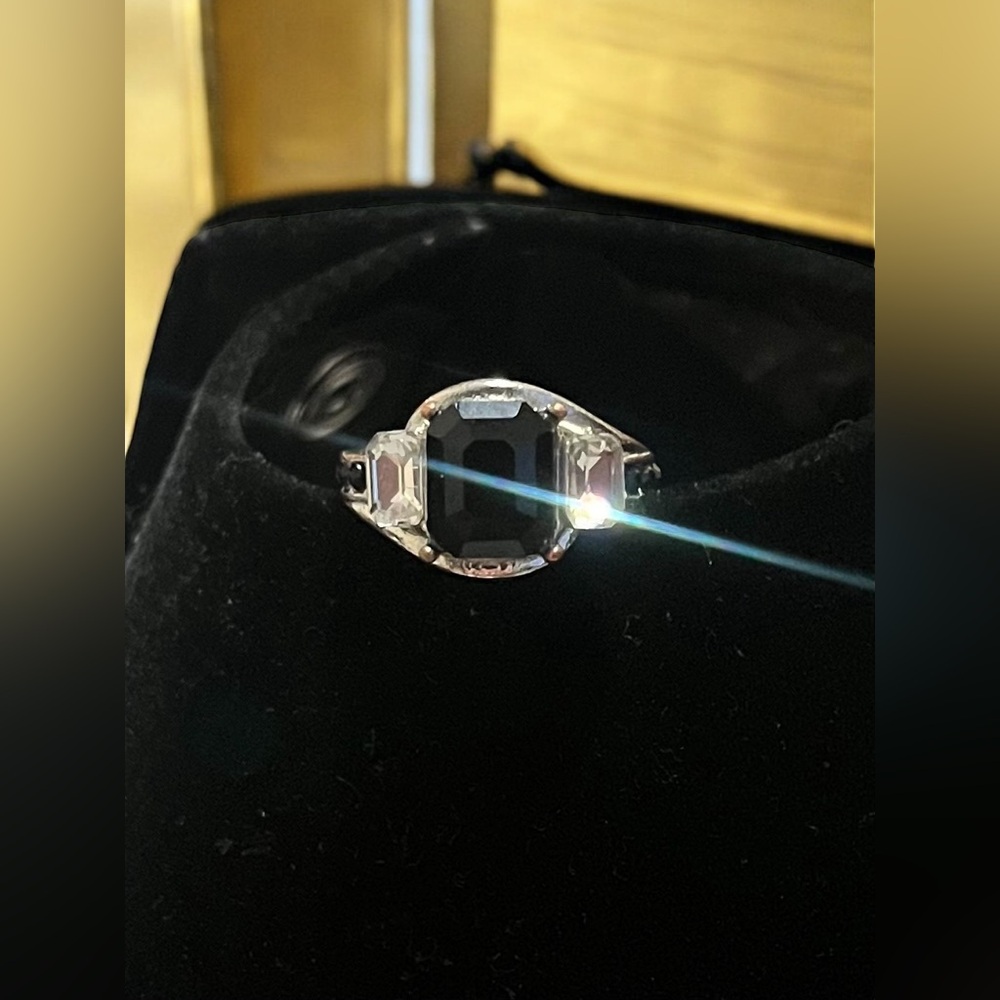 Elegant Cushion-Cut Black Gemstone Ring with Intricate Band Detailing
